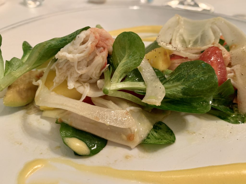 Salad with phalanx of Kamchatka crab, tomatoes and avocado